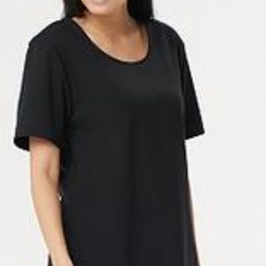 This oversized tunic exceeds expectations. The cut